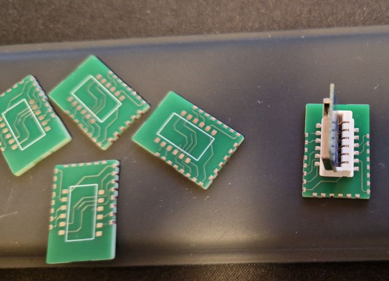 Printed Circuit Boards with Module Green printed circuit boards with a module mounted on one of them.