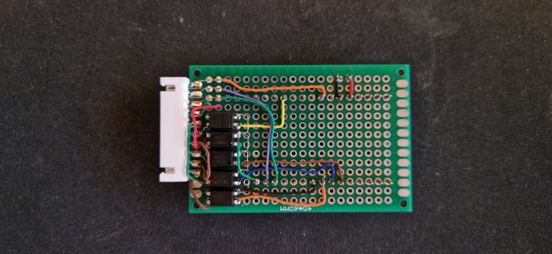 Prototype Board with Components and Wires Prototype board with soldered wires and electronic components.