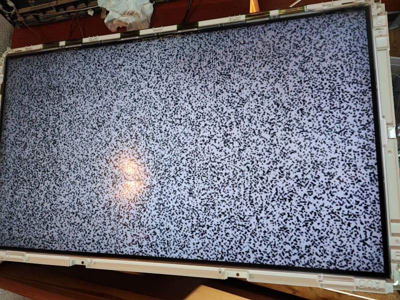 Testing Flooded Samsung TV Samsung TV with static on screen during post-flood test.