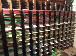 Large vertical 18650 cell rack with colorful cells and white compensating wedges