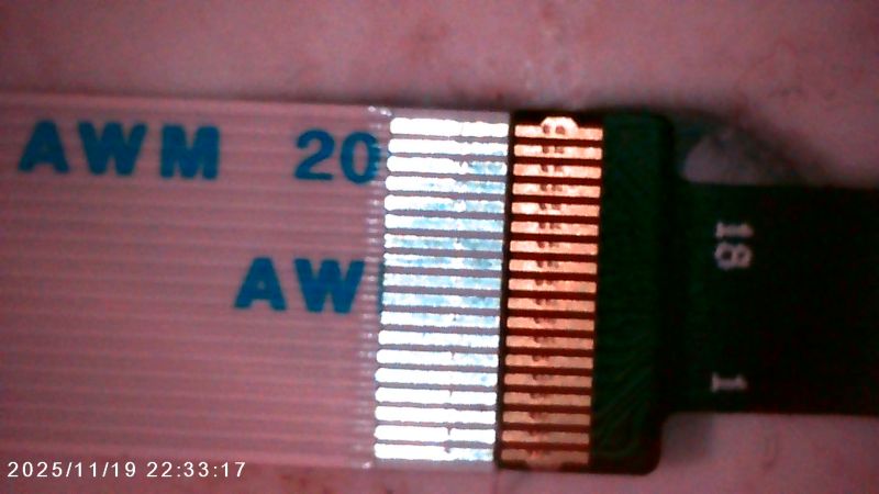 Close-up of AWM ribbon cable with exposed contact connector