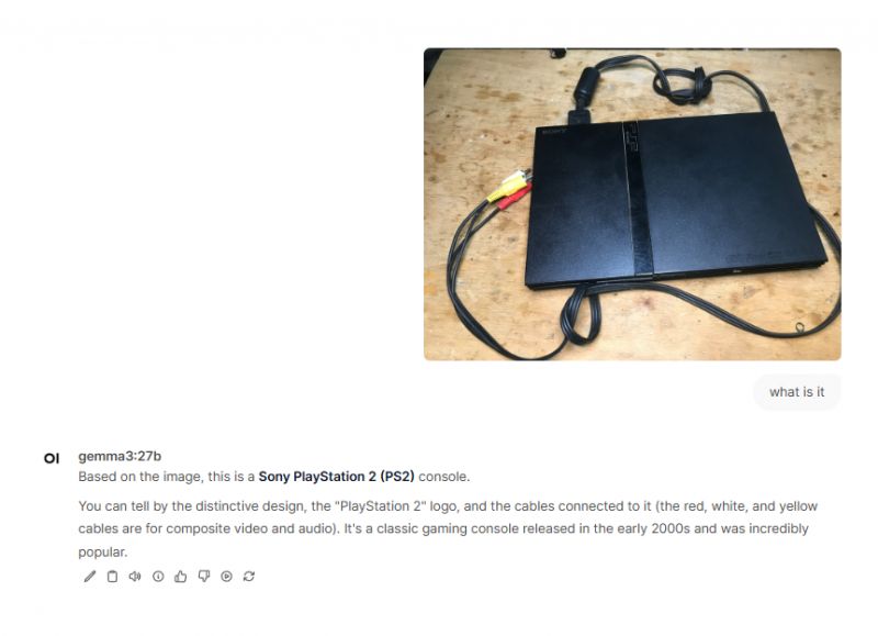 Sony PlayStation 2 Console with Cables Console with cabling on a wooden surface