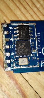 Close-up image of a section of an electronic circuit on a printed circuit board with visible chips and connectors.