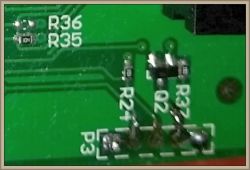 Close-up of a circuit board with markings and soldered components.