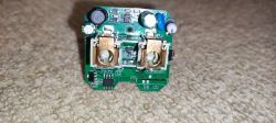 Interior of an Electronic Device on a PCB Interior of a disassembled electronic device with a visible PCB and components.