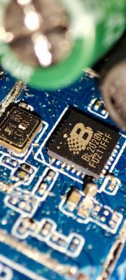 Close-up of a BL2028N integrated circuit on a blue printed circuit board.