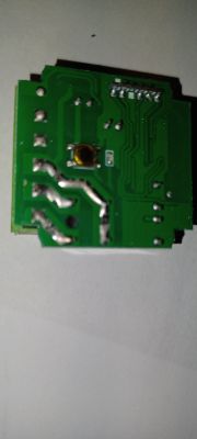 CB2S Printed Circuit Board Photo of a green printed circuit board with visible traces, solder points, and a small button.