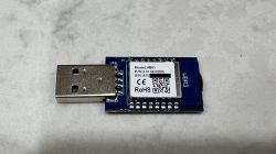 Tuya WBR3 WiFi Module – Top View Tuya WBR3 WiFi module with USB connector, top view showing label with model and serial number.