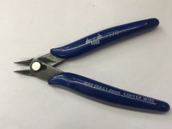 Blue diagonal cutting pliers on a light surface, with visible text on the handles.