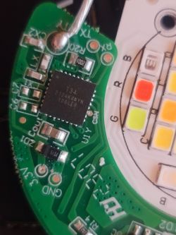 Close-up of a circuit board with electronic components and a chip labeled 134 2122-K8WYN K00LEB.