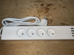 Woox R4027 Power Strip with USB Ports Woox R4027 four-socket power strip with USB ports.