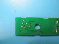 Printed circuit board with pin labels DL, 3.3V, TX, RX, GND, and EN on a green background.
