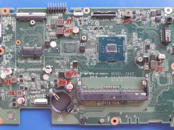 Laptop motherboard with red voltage readings marked near chips and connectors