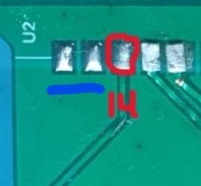 Close-up of PCB showing five solder pads near “U2”, one circled in red, with “14” marked below.