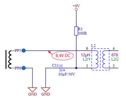 Fragment schematu elektronicznego z cewką ferrytową, rezystorem, kondensatorem i podłączeniem do napięcia 9V.