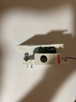 Photo of a disassembled EARU RDCBC2-WIFI power meter with exposed electronics.