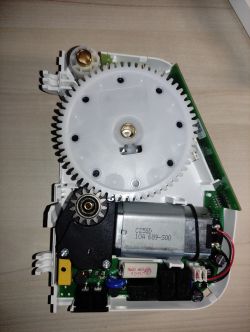 Inside the Rademacher RolloTron 1550 Roller Shutter Winder Inside view of the Rademacher RolloTron 1550 electric roller shutter winder showing gears and motor.