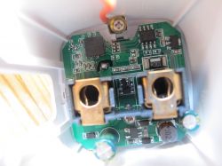 Interior of an electronic device with a visible circuit board and components.