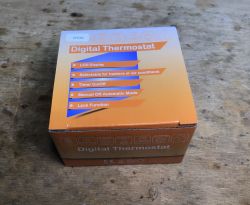 Box of KHY609 Digital Thermostat Orange box of the digital thermostat KHY609 with listed features on the front.