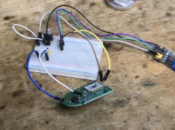 Programming SmartLED 8044 Board via UART SmartLED 8044 relay board connected to a breadboard and programmer via jumper wires.
