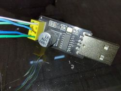 Non-soldering write testing device with an ESP01 serial reader, connected by wires to a pin connector.
