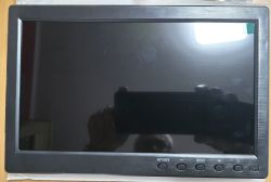 Black flat monitor with AV1/AV2 and MENU buttons on the lower bezel, screen off