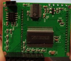 Green PCB with TM1621B and ISD1760 chips, labeled resistors and capacitors