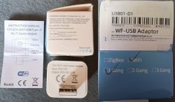 Wi-Fi USB Switch Module Set with Manual and Packaging The image shows a Wi-Fi USB switch module set with user manual, switch module, and packaging labeled WF-USB Adaptor.