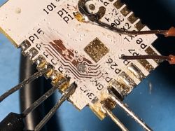 BK7231N Module with Soldered Wires Close-up of a BK7231N module with wires soldered to the pins on the circuit board.