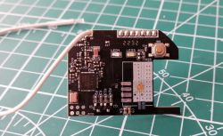 The image shows a PCB with soldered wires.