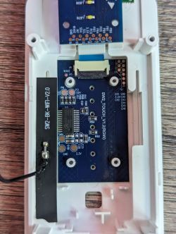 Close-up of the internal electronic circuitry of a Shelly Plus wall dimmer.