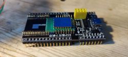 ESP32 Module on Development Board with Soldered Pins Close-up of an ESP32 module mounted on a development board with soldered pins.