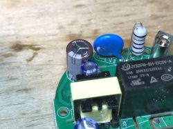 Components on a Circuit Board in Avatto N-TS10-W1 Switch Electronic components on a green printed circuit board.