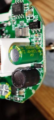 Smart Plug Circuit Board with Electronic Components Close-up of a smart plug circuit board with visible electronic components and capacitors.