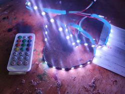 LED Controller Set with Remote LED controller set with a remote and glowing LED lights.