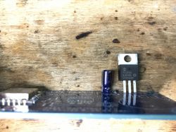 Electronic components for a clock project arranged on a table.