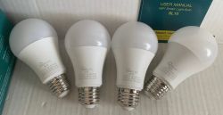 Treatlife SL10 Smart Bulbs Four Treatlife SL10 smart LED bulbs with a user manual.