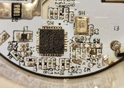 Printed Circuit Board with Zigbee Module Close-up of a printed circuit board with a microcontroller and SMD components.