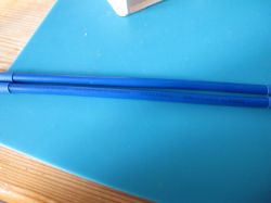 Two blue wires on a blue surface, marked as 450/750V.