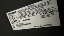 Hitachi rating label with warning text Hitachi warning and identification label on a device casing