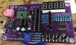 Assembled FM Radio V4.0 PCB with 4-digit 7-segment display, buttons, and USB connectors