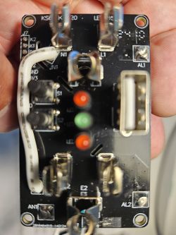 Electronic circuit board with components such as connectors, LEDs, and wires.