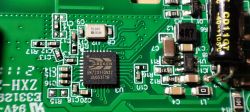 Printed Circuit Board with Beken BK7231TQN32 Chip Close-up of a printed circuit board with a Beken BK7231TQN32 chip on a green background.