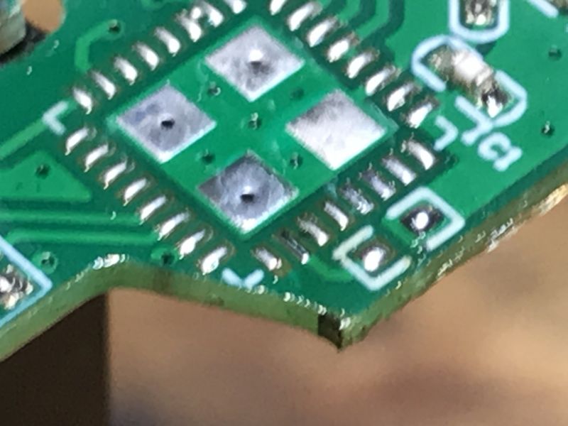 Close-up of a Printed Circuit Board Close-up of a green printed circuit board with exposed metal contacts and traces.