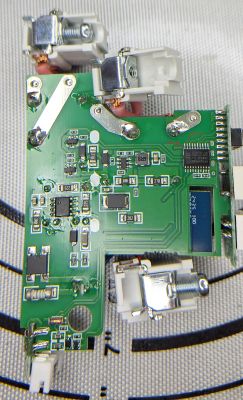 PCB with electronic SMD components and four DB9 connectors.