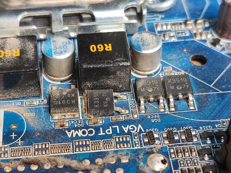 Electronic Components on a Computer Motherboard Close-up of components on a computer motherboard, including K3919 and K3918 transistors.