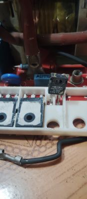 Close-up of an electronic component marked MDN745 mounted on a circuit board.