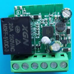 Gray PCB with various electronic components, including a relay, capacitor, and T34 integrated circuit.