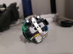 Close-up of the internal components of a smart power socket showing the electronic module.