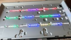 LED panel with multicolored RGB lights mounted on a metal surface